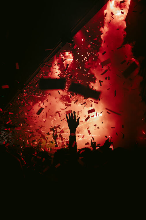 Hands raised in the confetti